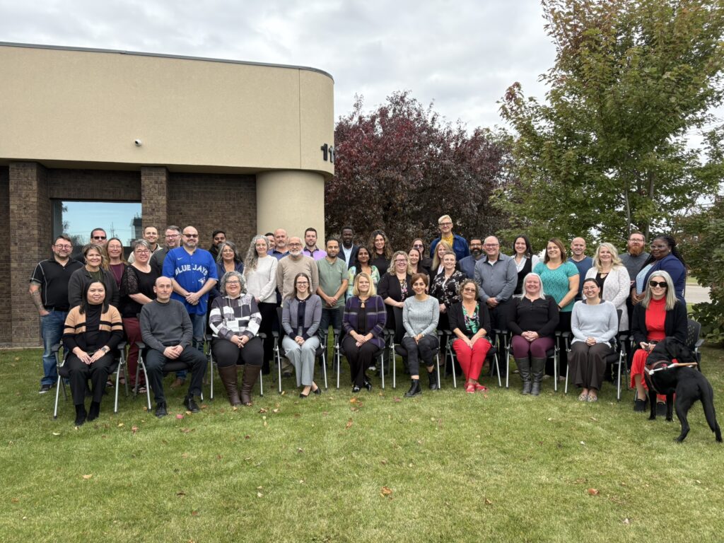 SARC Employees in a group in front of the Main Office Building